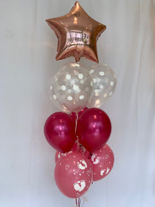 Bouquet de ballons en forme d'étoile rose, couleurs des autres ballons rose, fushia et transparent 