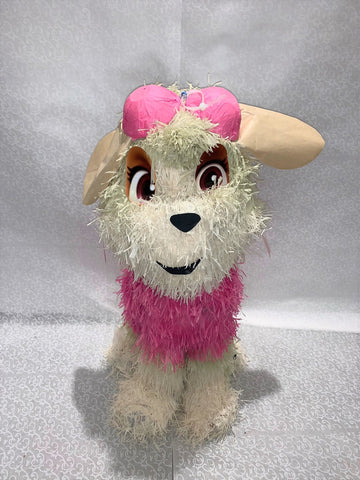 Piñata en forme de chien stella de pat patrouille beige et rose